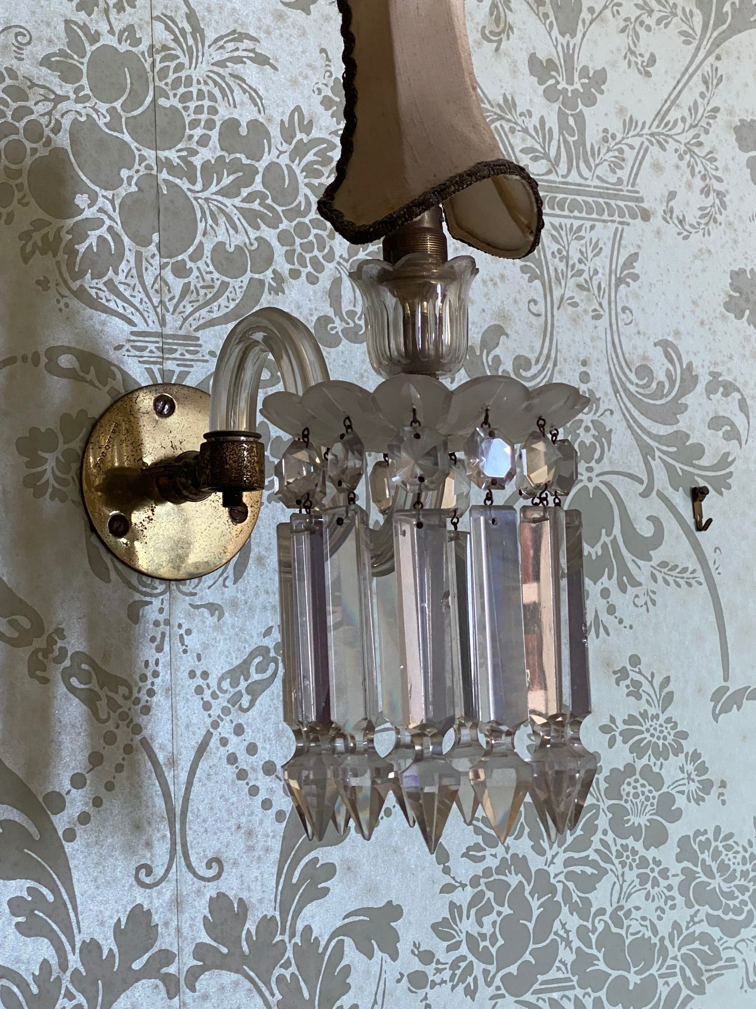 A near pair of glass lustre single branch wall lights, larger 26cm